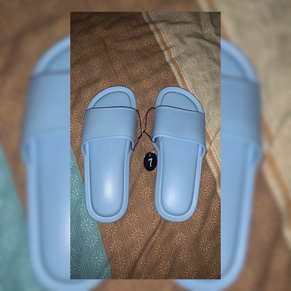 Women baby blue slippers size 7 supper comfortable and never worn!
